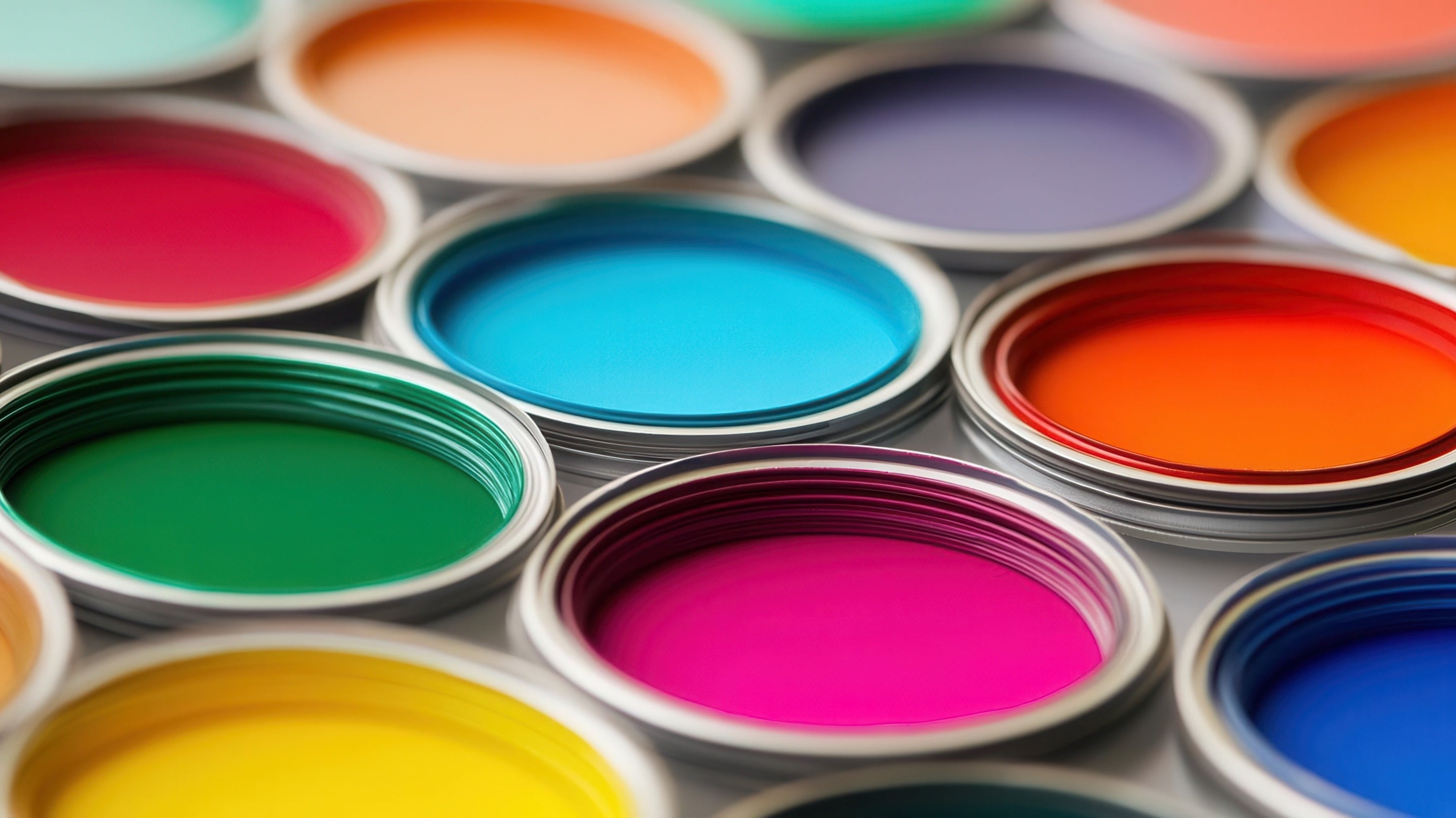 Paint can lids with a rainbow of colors