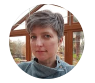 Person with short hair in a circular portrait